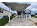 Inviting home showcasing covered parking, an accessible entrance and a well-kept lawn at 3333 26Th E Ave # 1145, Bradenton, FL 34208
