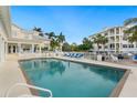 Inviting community pool area with comfortable lounge chairs and well-maintained surroundings, perfect for relaxation at 7611 34Th W Ave # 301, Bradenton, FL 34209