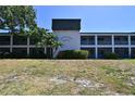 Whitaker Bayou condos feature screened porches and lush landscaping at 2124 Tamiami N Trl # 103, Sarasota, FL 34234