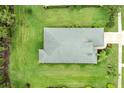 Overhead view of a well-maintained home with a neatly landscaped yard and visible roof details at 4654 Claremont Park Dr, Bradenton, FL 34211