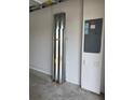 An unfinished garage with exposed brick walls at 5812 Ocean Isle Dr, Nokomis, FL 34275