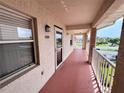 Condo balcony with seating and view of the complex grounds at 6505 Stone River Rd # 309, Bradenton, FL 34203