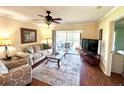 Cozy living room with sliding door access to the balcony at 6505 Stone River Rd # 309, Bradenton, FL 34203