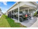 View of a well-maintained carport that provides ample space to shelter a car at 719 50Th Avenue W Ter, Bradenton, FL 34207