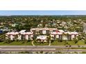 Spacious condominium complex with a well-maintained exterior, a swimming pool, and beautiful landscaping at 915 Beach Rd # 321, Sarasota, FL 34242