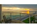 Relax on the balcony with breathtaking views of the ocean and coastline at 1000 Longboat Club Road # 1105, Longboat Key, FL 34228