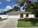 Inviting single-story home features a well-kept lawn and an attached two-car garage at 3918 Wake Ave, Sarasota, FL 34241