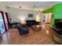 Bright living room with wood floors, comfortable furniture, and sliding doors at 3918 Wake Ave, Sarasota, FL 34241