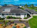 Attractive home featuring an eye-catching landscape with tropical plants and stone at 719 Estuary Dr # 719, Bradenton, FL 34209