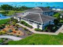 Aerial view of a cozy home surrounded by vibrant landscaping with tropical plants and walkways at 719 Estuary Dr # 719, Bradenton, FL 34209