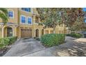 Beautiful townhome with attached garage, stucco facade, and a well-manicured yard at 8823 White Sage Loop # 1802, Lakewood Ranch, FL 34202