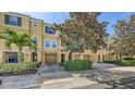 Inviting townhome community with well-maintained landscaping, private garages, and manicured trees at 8823 White Sage Loop # 1802, Lakewood Ranch, FL 34202