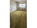 Cozy bedroom featuring natural light from the window and neutral walls at 9950 62Nd N Ter # 401, St Petersburg, FL 33708