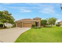 Attractive home exterior with a well-manicured lawn and neat landscaping, plus a 3-car garage at 2819 47Th E St, Palmetto, FL 34221