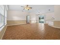 Spacious living room with tile floors and a neutral color scheme at 1340 Papillon St, North Port, FL 34287