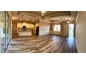Open living room and kitchen with tile floors and island at 4209 Titan St, North Port, FL 34286