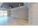Light and airy living room with hardwood floors and sliding glass doors at 6782 Paigo Ln, North Port, FL 34291