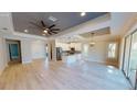 Spacious living room with hardwood floors, high ceilings, and modern lighting at 6782 Paigo Ln, North Port, FL 34291