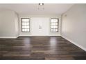 Living room with hardwood floors and double doors at 525 Medici Ct, Punta Gorda, FL 33950