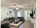 Living Room with gray sofa, coffee table, and hardwood floors at 3106 Harbor Blvd # 3A, Port Charlotte, FL 33952