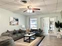 Living Room with gray sofa, coffee table, and hardwood floors at 3106 Harbor Blvd # 3A, Port Charlotte, FL 33952