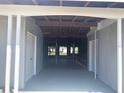 View of a garage with storage space and access to the backyard at 127 Godfrey Ave, Port Charlotte, FL 33952