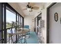 Bright lanai with seating and scenic views at 14459 River Beach Dr # 202, Port Charlotte, FL 33953