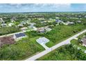 Aerial view of a house in a residential neighborhood at 9245 Zorn St, Port Charlotte, FL 33981