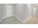 Tile hallway with access to rooms and closets at 255 West End Dr # 1412, Punta Gorda, FL 33950