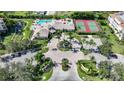 Community view with pool, tennis courts, and parking at 255 West End Dr # 1412, Punta Gorda, FL 33950