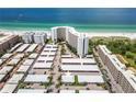 Aerial view of condo building and parking lot, highlighting a specific unit at 6300 Midnight Pass Rd # 20, Sarasota, FL 34242