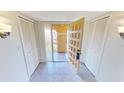 Condo entryway with doors to balcony and closets at 1 Colony Point Dr # 5C, Punta Gorda, FL 33950