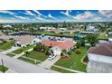 Single-story home on a canal with a large yard and two-car driveway at 234 Fields Se Ter, Port Charlotte, FL 33952