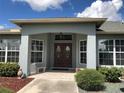 Front entrance with double doors and a covered porch at 1307 Tidy Ln, Punta Gorda, FL 33983