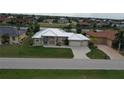 Single Gathering home situated on a tree lined street with a view of a canal at 2325 Padre Island Dr, Punta Gorda, FL 33950