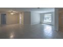 Bright dining room with tile floors and a ceiling fan at 110 Bedford Ne Dr, Port Charlotte, FL 33952