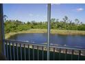 View from screened balcony overlooking a pond at 175 Kings Hwy # 923, Punta Gorda, FL 33983