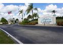 Condominium entrance with signage and landscaping at 175 Kings Hwy # 923, Punta Gorda, FL 33983