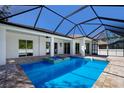 Inviting pool area with covered patio and spa at 9453 Zorn St, Port Charlotte, FL 33981