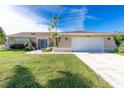 Charming single-story home with well-maintained lawn, attached garage, and beautiful curb appeal at 1759 Nuremberg Boulevard, Punta Gorda, FL 33983