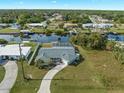 Aerial view of canal-front home with pool and private dock at 3341 Rock Creek Dr, Port Charlotte, FL 33948