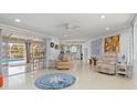 Bright living room with view of pool and kitchen at 3341 Rock Creek Dr, Port Charlotte, FL 33948