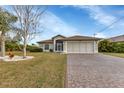 Well-maintained house with a spacious driveway at 176 Jennifer Dr, Rotonda West, FL 33947