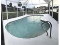 Relaxing kidney-shaped pool with screened enclosure at 4127 Gardner Dr, Port Charlotte, FL 33952