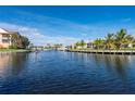 Waterfront community with homes and boats along a canal at 1439 Mediterranean Dr # C, Punta Gorda, FL 33950