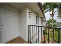 Condo building entrance with private balcony at 26485 Rampart Blvd # D28, Punta Gorda, FL 33983