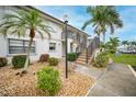 Condo building with well-maintained landscaping at 26485 Rampart Blvd # D28, Punta Gorda, FL 33983