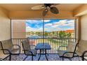 Balcony with patio furniture and water views at 3322 Purple Martin Dr # 135, Punta Gorda, FL 33950
