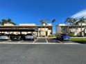 Exterior view of condo building with covered parking at 9209 Seminole Blvd # 117, Seminole, FL 33772