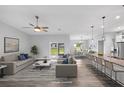 Open living room featuring hardwood floors, and access to backyard at 825 Haleybury St, Port Charlotte, FL 33948